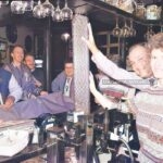 Sister Caroline King from the Wrexham Hospital Renal Unit, topples a pile of 10 pence pieces collected by regulars at the Oak Tree Inn November 1991