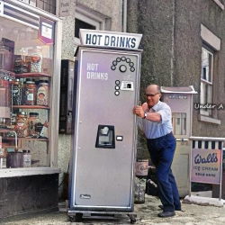 A hot drinks machine being installed in January 1966 at Swains Local Stores Wrexham