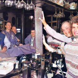 Sister Caroline King from the Wrexham Hospital Renal Unit topples a pile of 10 pence pieces collected by regulars at the Oak Tree Inn November 1991 1