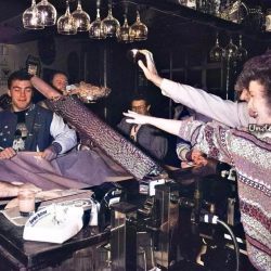 Sister Caroline King from the Wrexham Hospital Renal Unit topples a pile of 10 pence pieces collected by regulars at the Oak Tree Inn November 1991 2