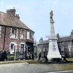 War Memorial Johnstown.In the background is the old Red Lion public house demolished to make way for the new houses known as Hafod y Glyn